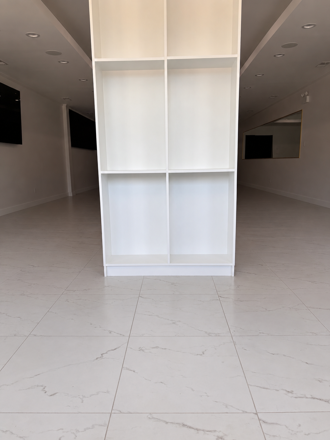 Bonita Salon front column before styling, with empty shelving and no seating or product display