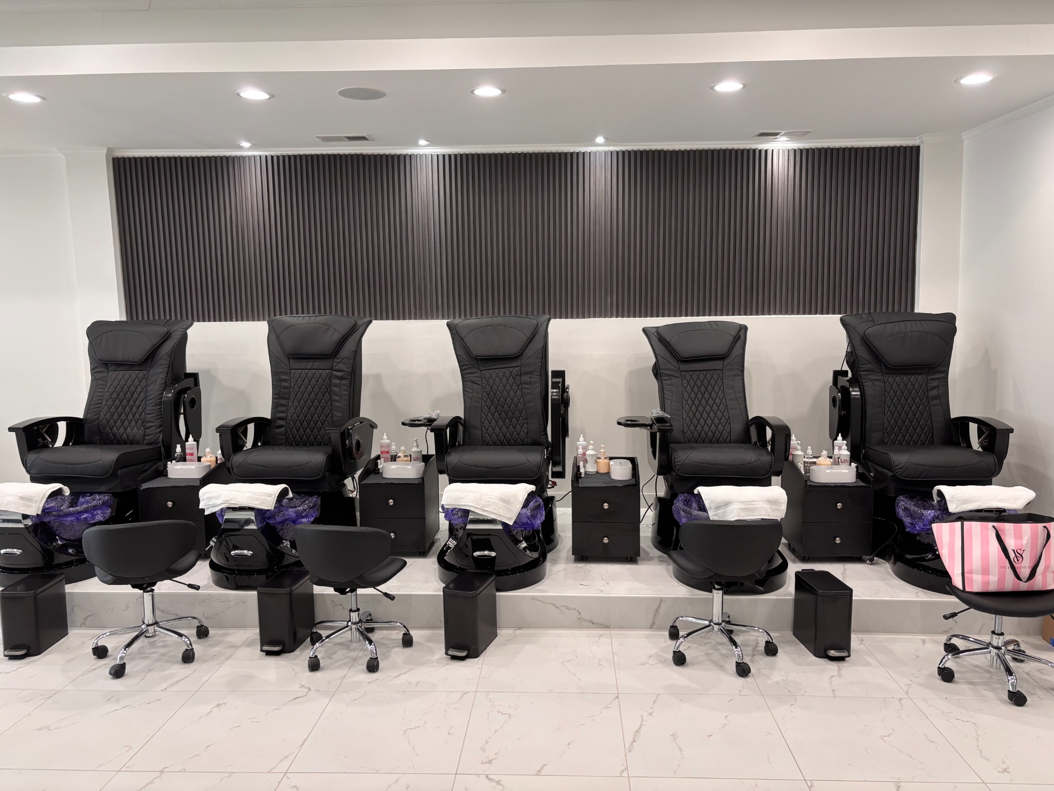 Bonita Salon manicure and pedicure lounge before wall lettering and accent lighting