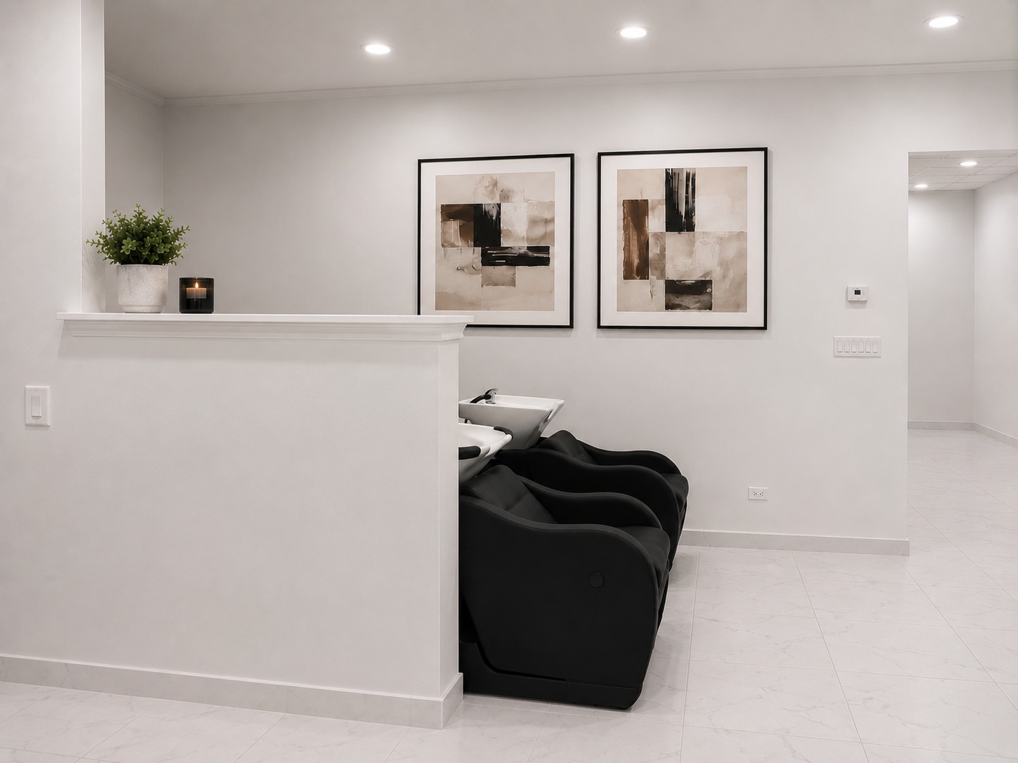 Bonita Salon shampoo bowl area after adding a pony wall for client privacy and coordinated artwork