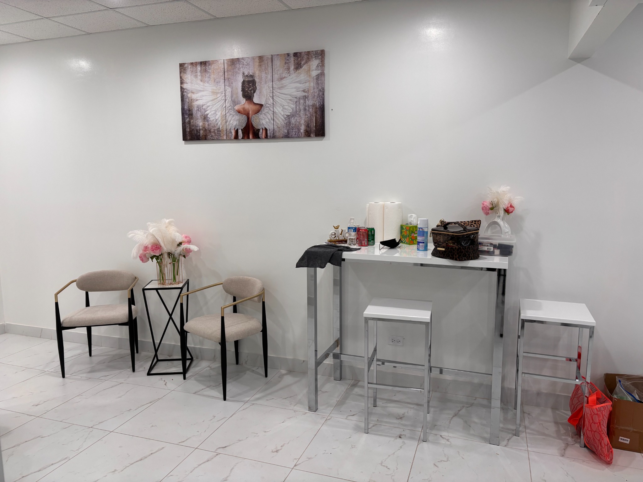 Bonita Salon suites waiting area before defined seating, built-in storage, and coordinated finishes